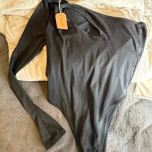 Jireh cut out, one sleeve bodysuit new with tags size large
